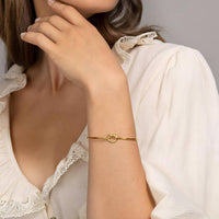 18K gold plated knot bangle worn wrist Kuwait Jewelique
